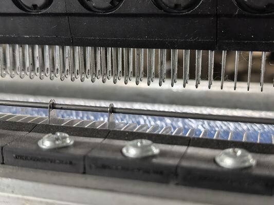 Begrijpen van de rol van geleidingsbalken in warpbreimachines